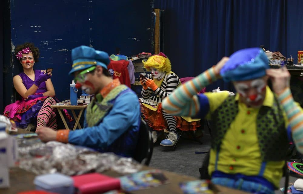 Ringling Bros. clowns take a break between acts in "Clown Alley," a private area backstage on May 5. (Julie Jacobson/AP)