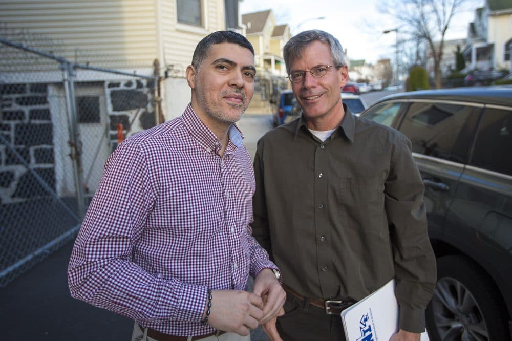 Tony Hernandez, left, and Harry Smith say their community land trust has put development decisions into the hands of the community. "Our motto ... is development without displacement," Smith said. (Jesse Costa/WBUR)
