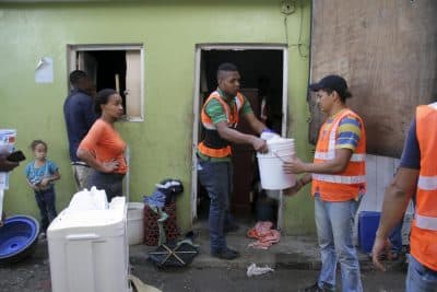 Maria Isabel Reyes watched workers pack up her life. "I feel nervous," she said. (Mariana Dale/KJZZ)
