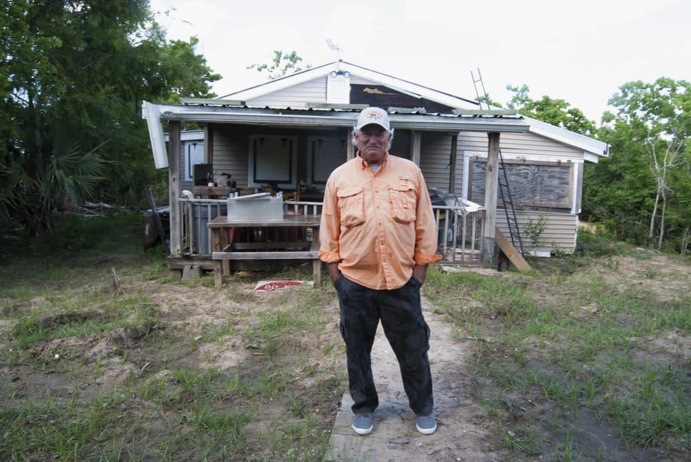 Kevin Rutley stands on land owned by his family on the Barataria Waterway. (Virginia Hanusik for Here & Now)