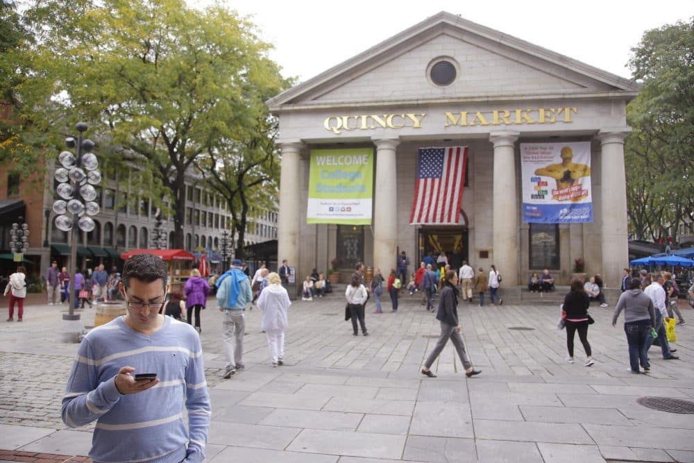Pedestrians and visitors to Quincy Market in Boston Oct. 7, 2014. It has been four decades since the market became the inspiration for pedestrian city centers across the nation. (Stephan Savoia/AP)