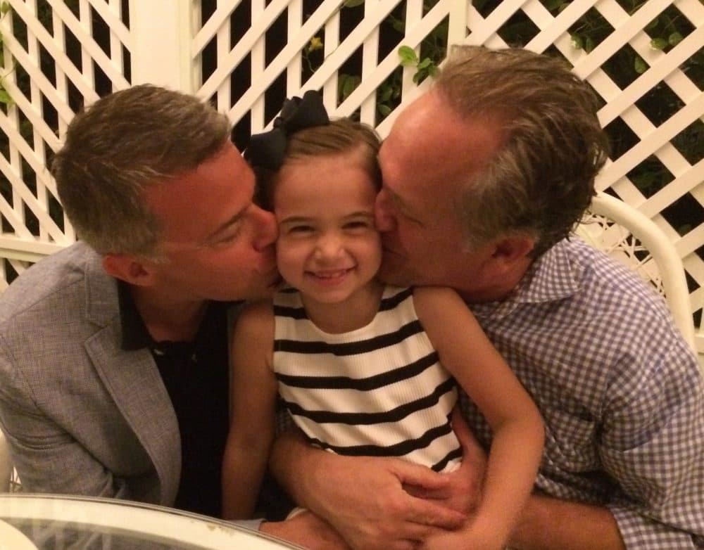 Russell Granet, left, Sadie Granet-Beach and David Beach, right, in a family hug (Courtesy of David Beach)