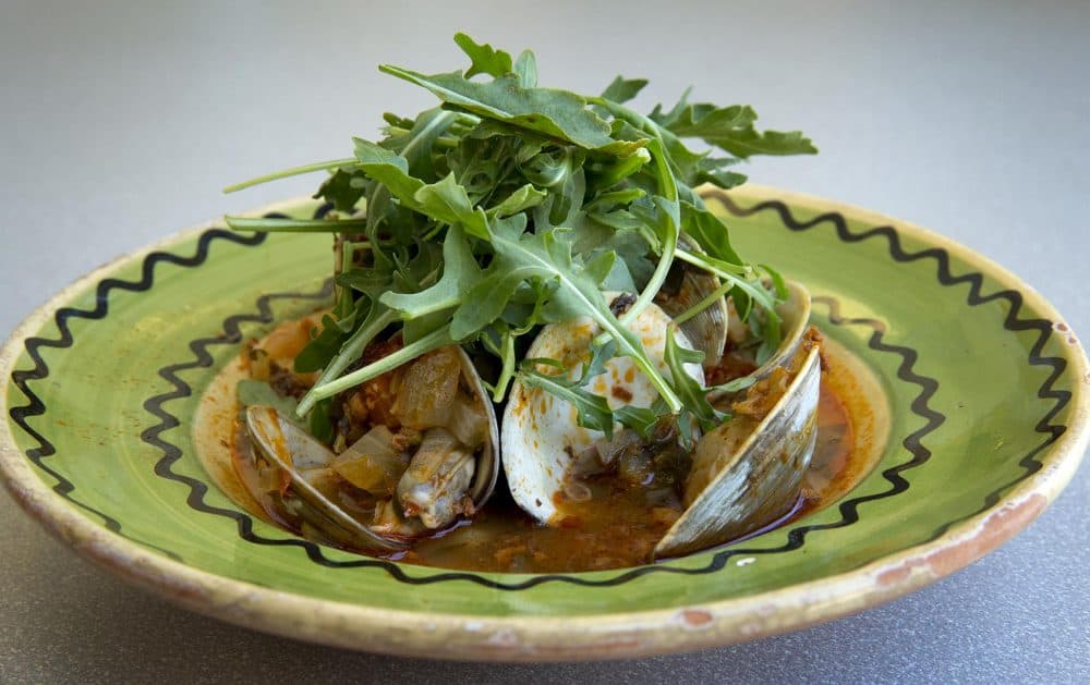 Kathy's clam and chorizo soup with tomatoes and arugula. (Robin Lubbock/WBUR)