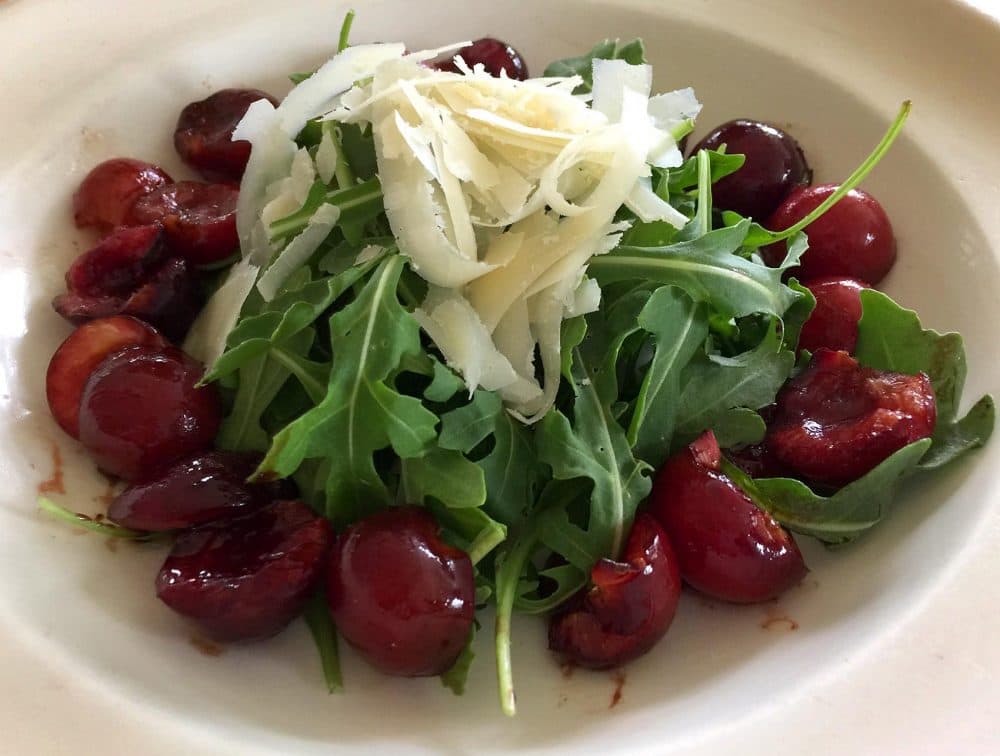Kathy's roasted balsamic cherry salad with arugula and Parmesan shavings. (Kathy Gunst for Here & Now)