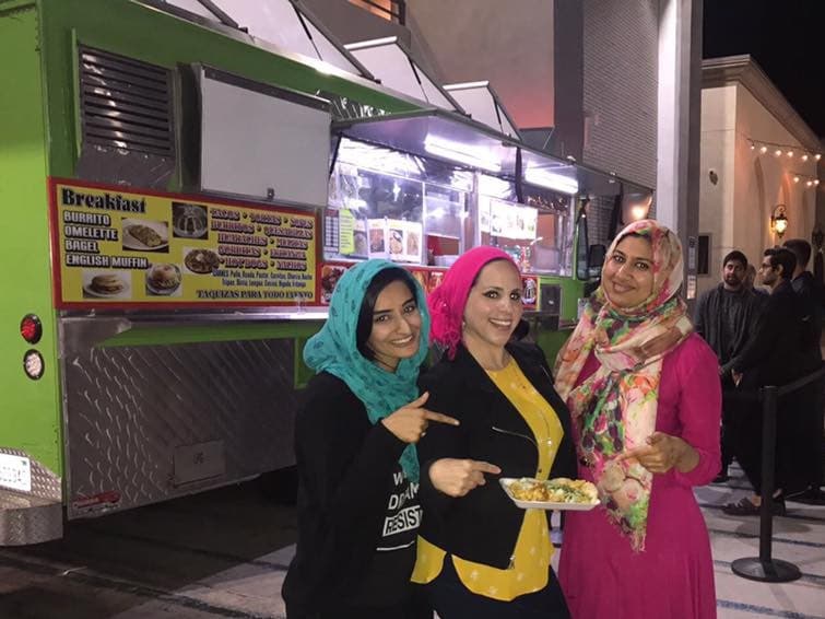 Rida Hamida (center), one of the organizers of Taco Trucks At Every Mosque, at an event at the Islamic Society of Orange County. (Courtesy)