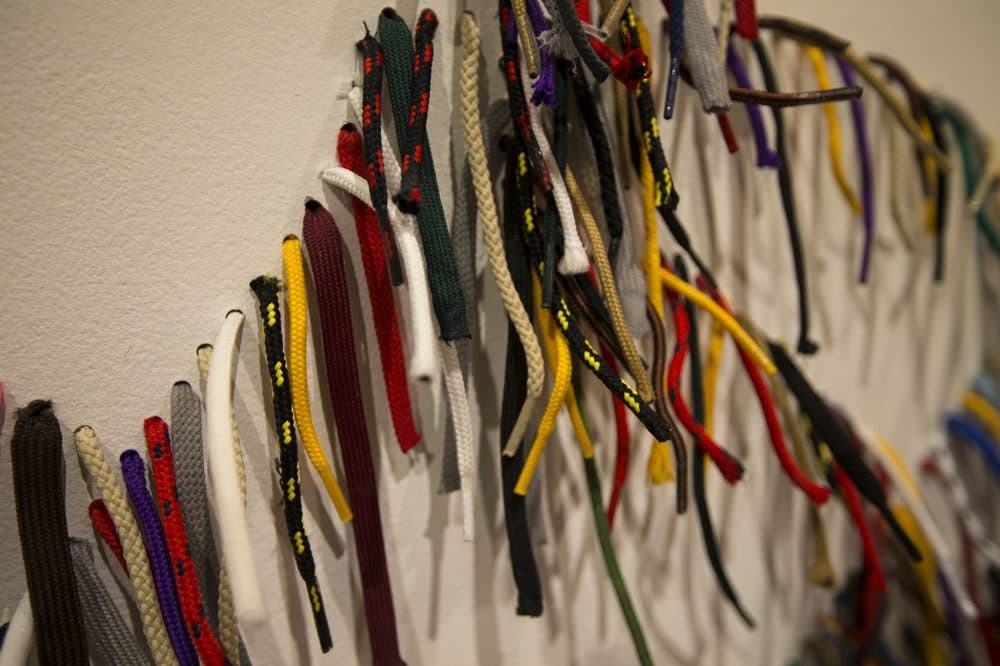 A close up of the shoelace work by Nari Ward for his work, "We the People." (Jesse Costa/WBUR)
