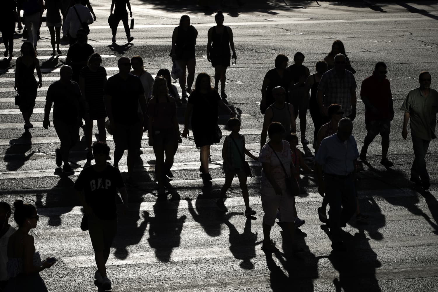 People cross Las Vegas Boulevard as the sun beats down, Tuesday, June 20, 2017, in Las Vegas. The first day of summer is forecast to bring some of the worst heat the southwestern U.S. has seen in years. (John Locher/AP)
