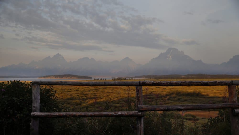 The morning sun illuminates the Grand Tetons in Grand Teton National Park, north of Jackson Hole, Wyo. in August 2016. (Brennan Linsley/AP)