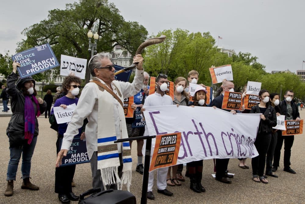 Religious leaders, and others, gather outside the White House on April 19, 2017, during a demonstration to admonish Trump administration actions on climate. (Manuel Balce Ceneta/AP)
