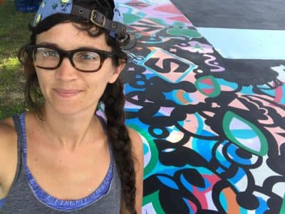 Maria Molteni at her "Hard In the Paint" basketball court mural at Boston's Harambee Park. (Courtesy Maria Molteni)