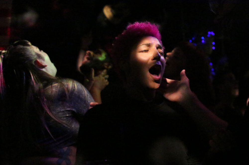 People dance at a recent Queeraoke night at the Midway Cafe. (Hadley Green for WBUR)