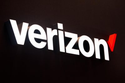A logo sits illuminated outside the Verizon pavilion during the Mobile World Congress 2017 in Barcelona, Spain. (David Ramos/Getty Images)