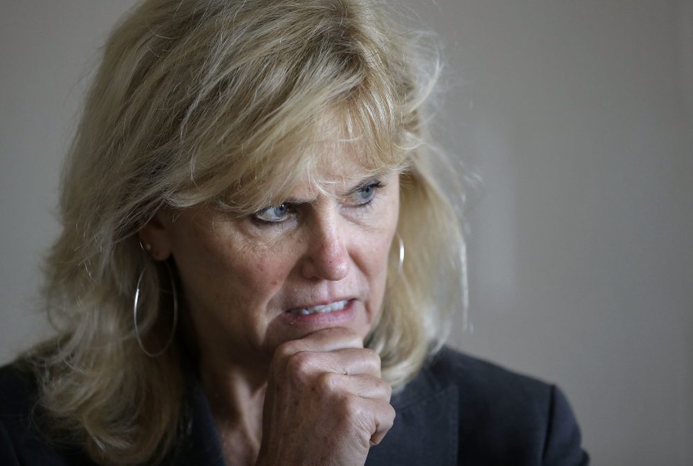 Boston University School of Medicine scientist Ann McKee speaks with researchers following a meeting held to launch a seven-year study into chronic traumatic encephalopathy, or CTE, at the school, Wednesday, June 1, 2016, in Boston. (Steven Senne/AP)