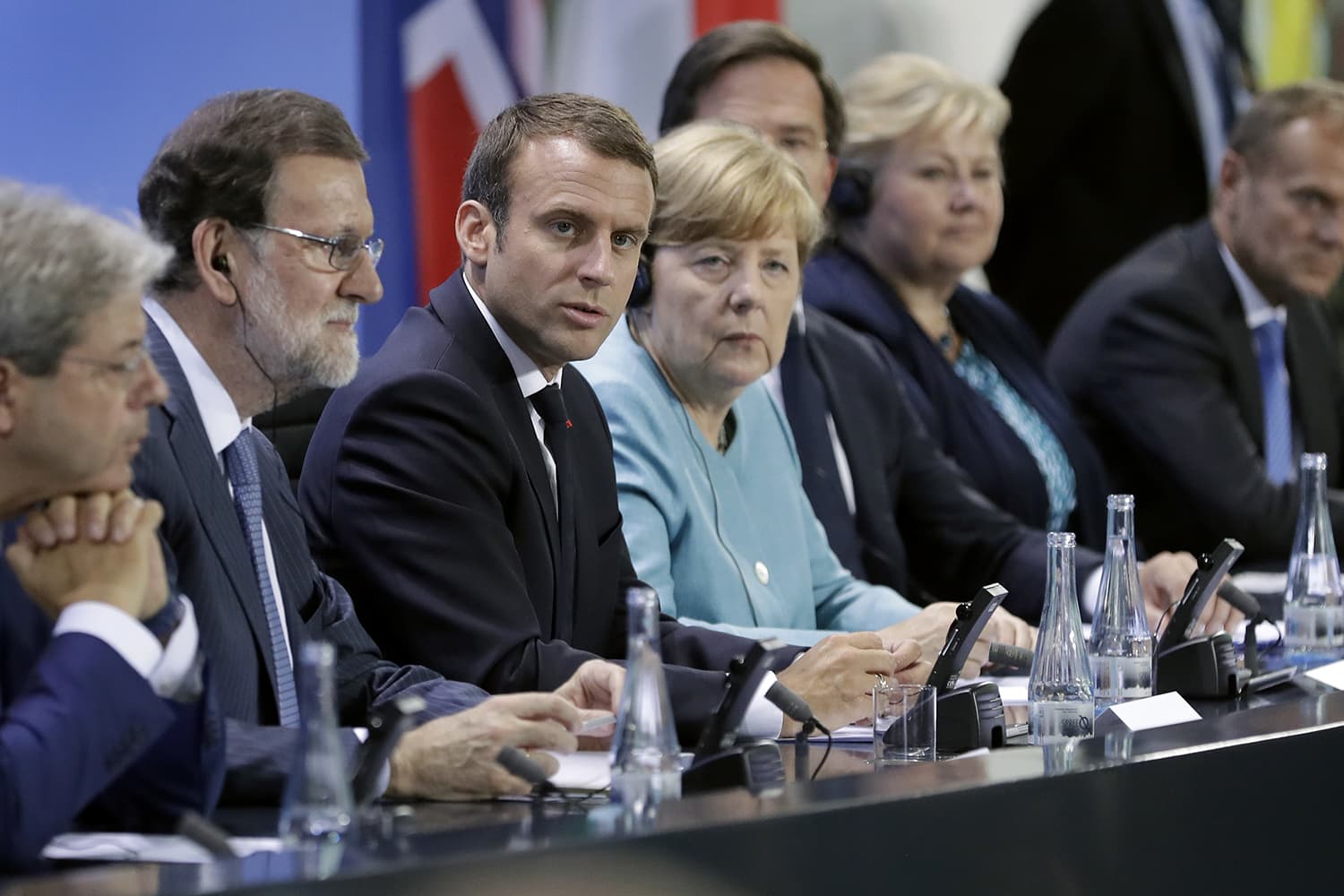 From left, Italian Prime Minister Paolo Gentiloni, Spain's Prime Minister Mariano Rajoy, France's President Emmanuel Macron, German Chancellor Angela Merkel, the Netherland's Prime Minister Mark Rutte, Norway's Prime Minister Erna Solberg and European Council President Donald Tusk, address the media in Berlin, Germany, Thursday, June 29, 2017. (Michael Sohn/AP)