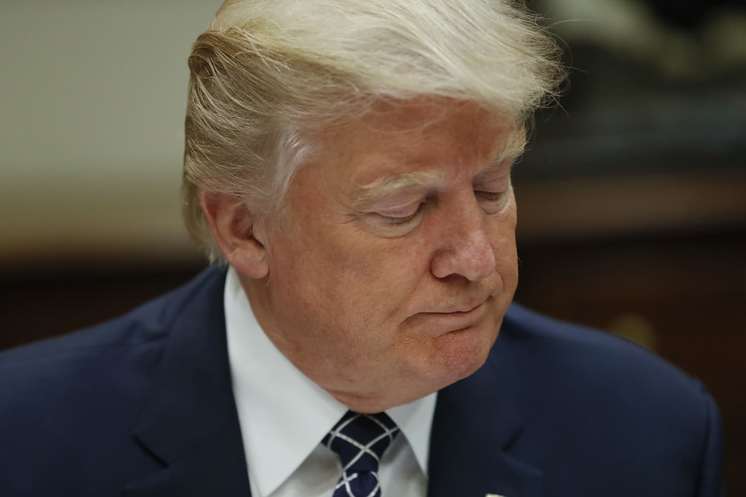 President Donald Trump pauses while having lunch with services members in the Roosevelt Room of the White House in Washington, Tuesday, July 18, 2017. (Pablo Martinez Monsivais/AP)
