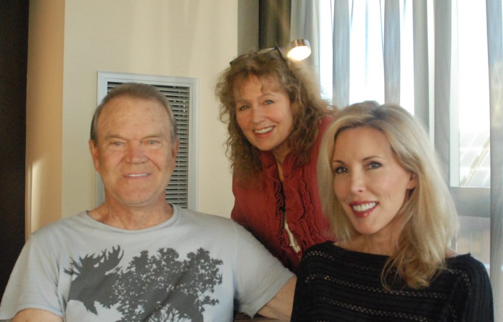 Here & Now’s Robin Young (center) visited with Glen Campbell and his wife Kim in 2012. (Alex Ashlock/Here & Now)