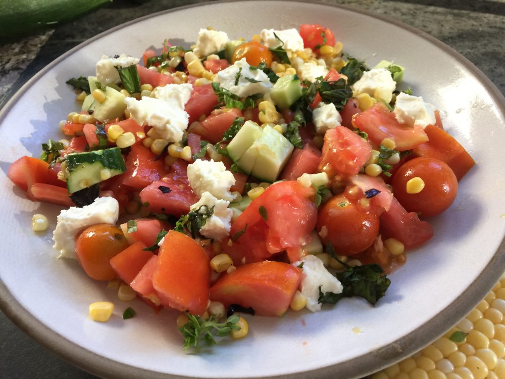 Kathy's sautéed corn salad with tomatoes, cucumber and feta with basil vinaigrette. (Kathy Gunst for Here & Now)