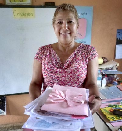 Lempira Elementary School teacher Miriam Avila displays her students' letters. (Karyn Miller-Medzon/Here & Now)