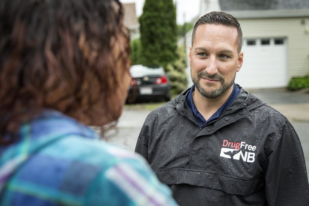 Pastor Jamie Casey, of the South Coast Community Church and Positive Action Against Chemical Addiction, talks with Tenelle Pina. (Robin Lubbock/WBUR)