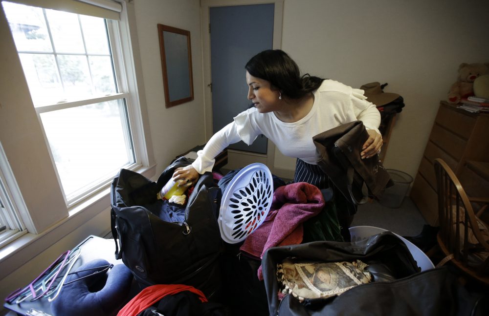Ninotska Love, who has been accepted at Wellesley College, unpacks in her dorm room at the women's school, in Wellesley, Mass. (Stephen Senne/AP)