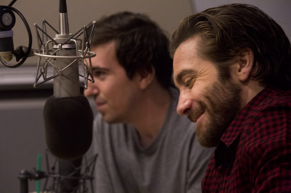 Jake Gyllenhaal, front, and Jeff Bauman in the WBUR studio during an interview on Here & Now. (Jesse Costa/WBUR)