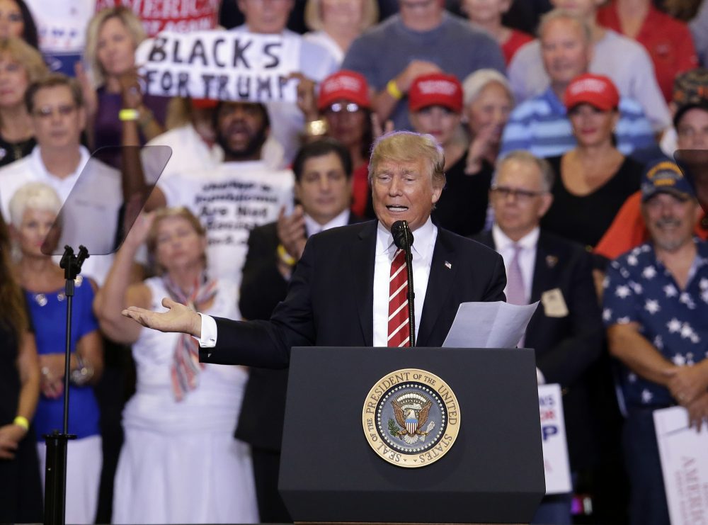 President Donald Trump gestures to the crowd while speaking at a rally at the Phoenix Convention Center, Tuesday, Aug. 22, 2017, in Phoenix. (Rick Scuteri/AP)