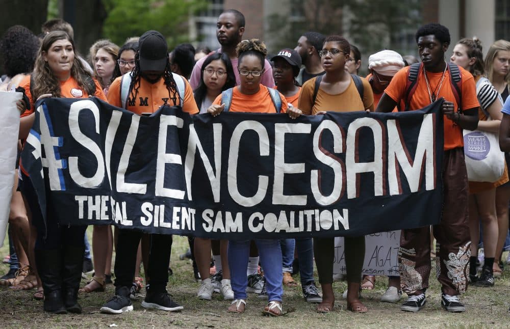 Protesters gather at a Confederate monument known as "Silent Sam" on campus at the University of North Carolina in Chapel Hill, N.C., Thursday, Aug. 31, 2017. (Gerry Broome/AP)