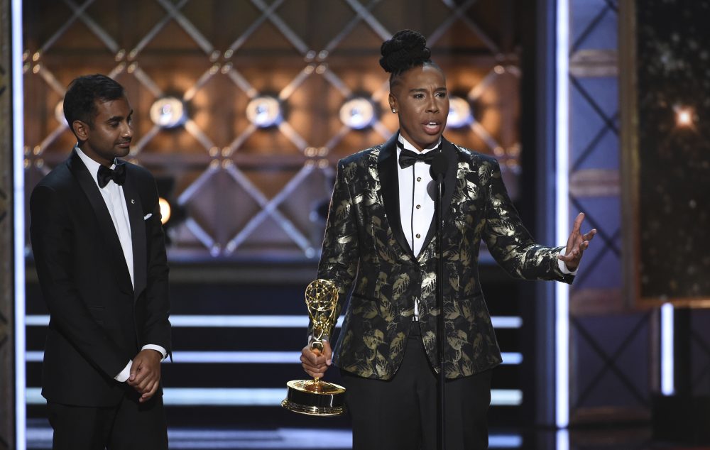 Aziz Ansari, left, and Lena Waithe accept the award for outstanding writing for a comedy series for the "Master of None" episode "Thanksgiving." (Phil McCarten/Invision for the Television Academy/AP)