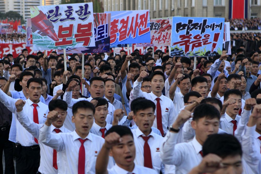 North Koreans gather at Kim Il Sung Square to attend a mass rally against America on Saturday, Sept. 23, 2017, in Pyongyang, North Korea, a day after the country's leader issued a rare statement attacking Donald Trump. The sign on the left reads "decisive revenge" and the sign on the right reads "death to the American imperialists." (Jon Chol Jin/AP)