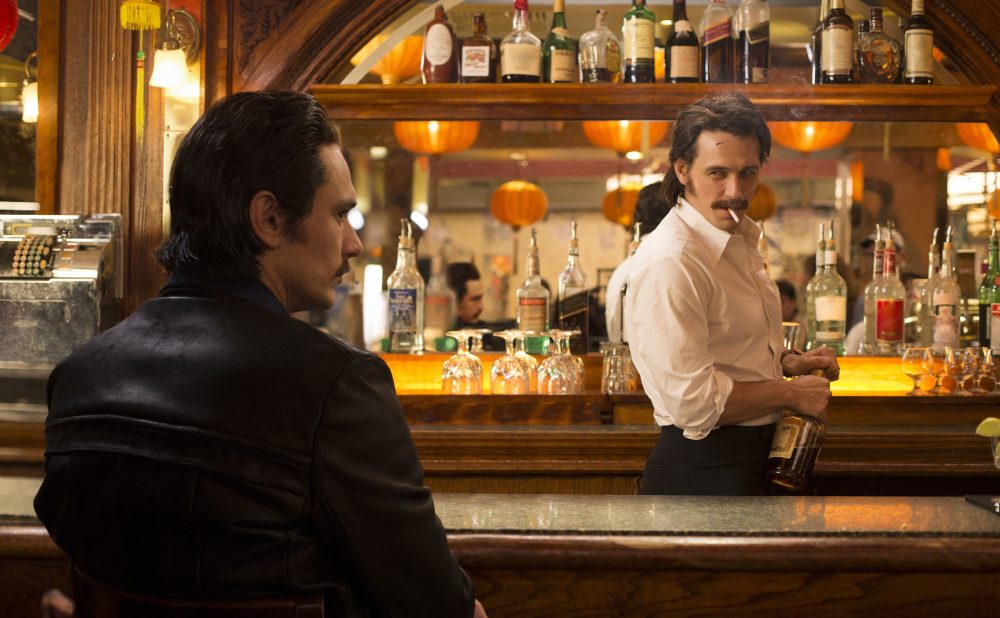 This image released by HBO shows James Franco portraying twins Vincent and Frankie Martino in, "The Deuce," a new HBO series about Times Square in the early 1970s. (HBO via AP)