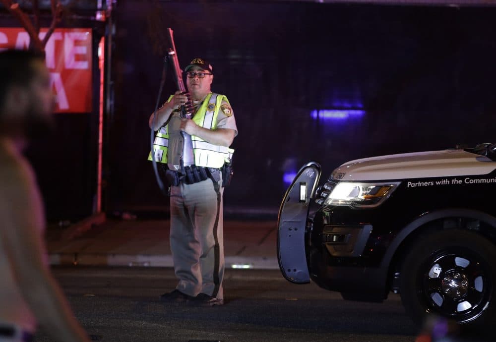 A police officer stands at the scene Monday morning. (John Locher/AP)