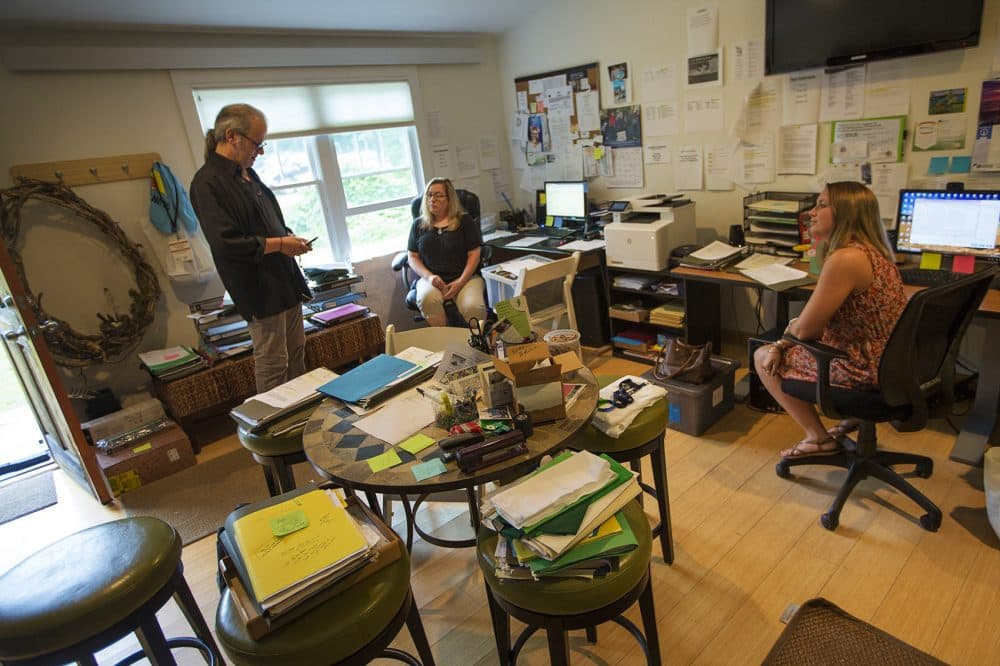 Hoffman talks with staff at the CCALS office in Falmouth before heading out to appointments in Rhode Island. (Jesse Costa/WBUR)
