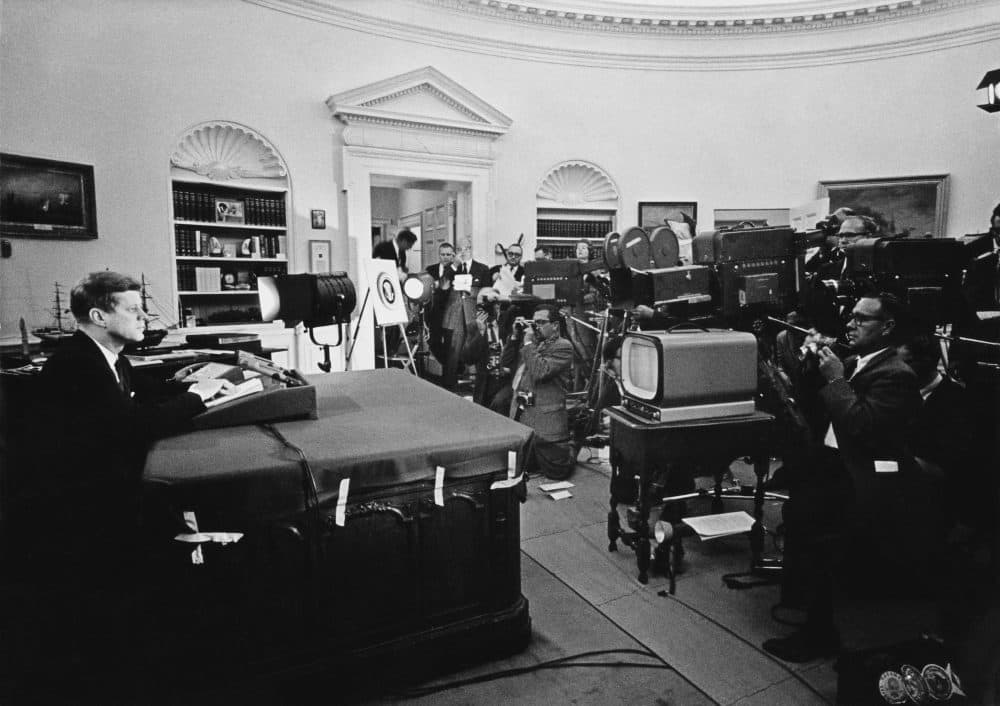 President John F. Kennedy announces on television the strategic blockade of Cuba, and his warning to the Soviet Union about missile sanctions during the Cuban missile crisis, on Oct. 22, 1962. (Keystone/Getty Images)