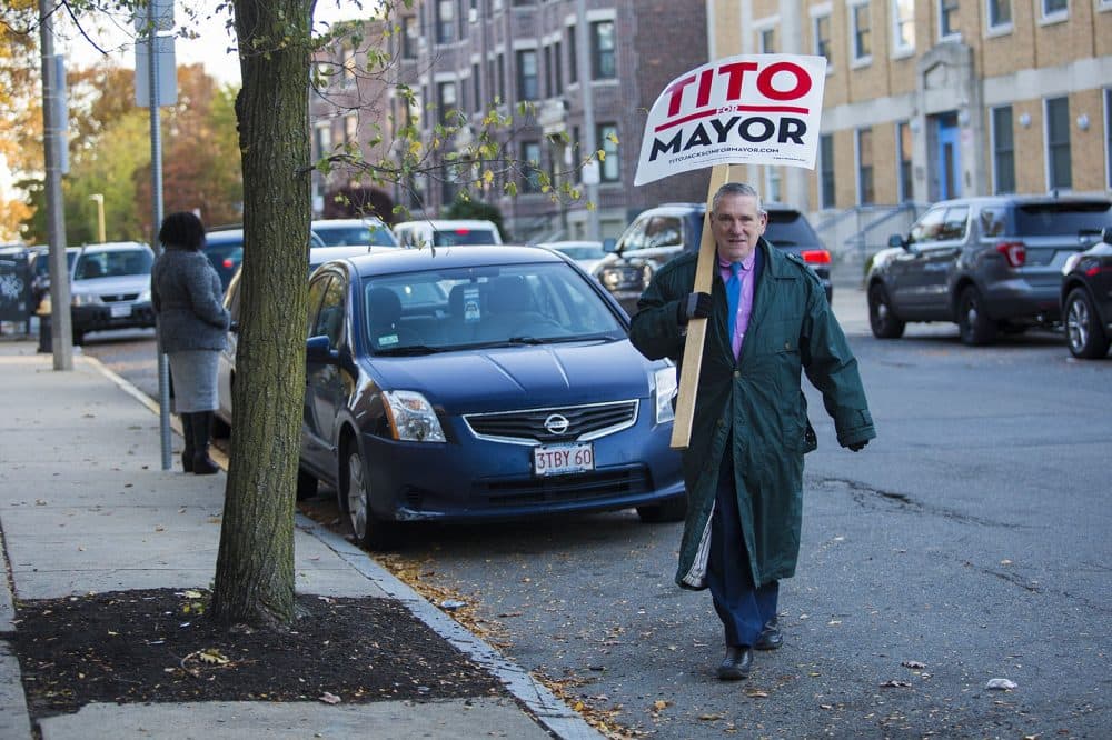 Gerry Ready, of Roxbury, carries a sign supporting Tito Jackson. (Jesse Costa/WBUR)