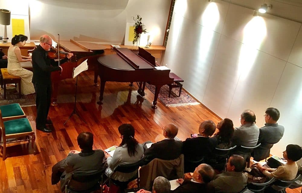 Boston Symphony Orchestra violist Michael Zaretsky and Japanese pianist Chikako Shibata perform at a private musical hall on Monday in Ishinomaki, Japan. (Andrea Shea/WBUR)