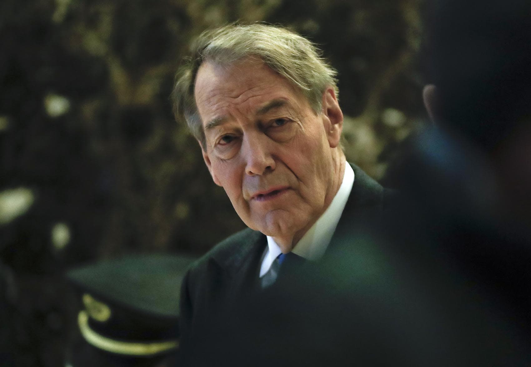 TV anchor Charlie Rose walks through Trump Tower, Monday, Nov. 21, 2016 in New York. (Carolyn Kaster/AP)
