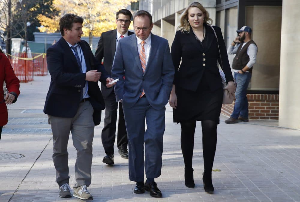 Mick Mulvaney, center, returns to the Consumer Financial Protection Bureau in Washington on Nov. 27, 2017. (Jacquelyn Martin/AP)