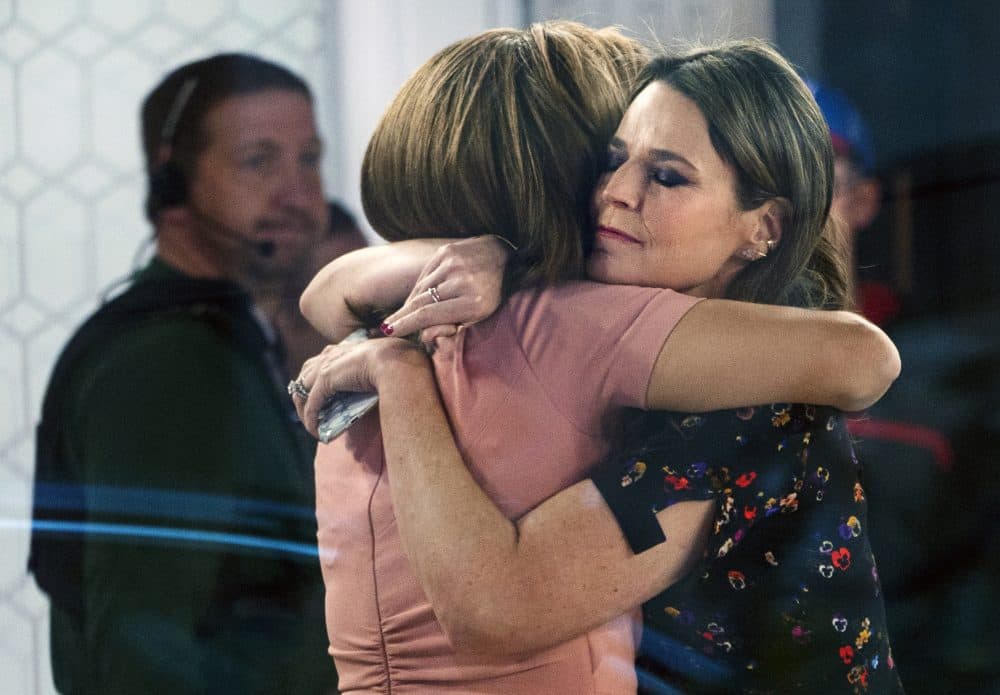 Co-anchors Hoda Kotb, left, and Savannah Guthrie embrace on the set of the "Today" show Wednesday, Nov. 29, 2017, in New York, after NBC News fired host Matt Lauer. NBC News announced Wednesday that Lauer was fired for "inappropriate sexual behavior." (Craig Ruttle/AP)