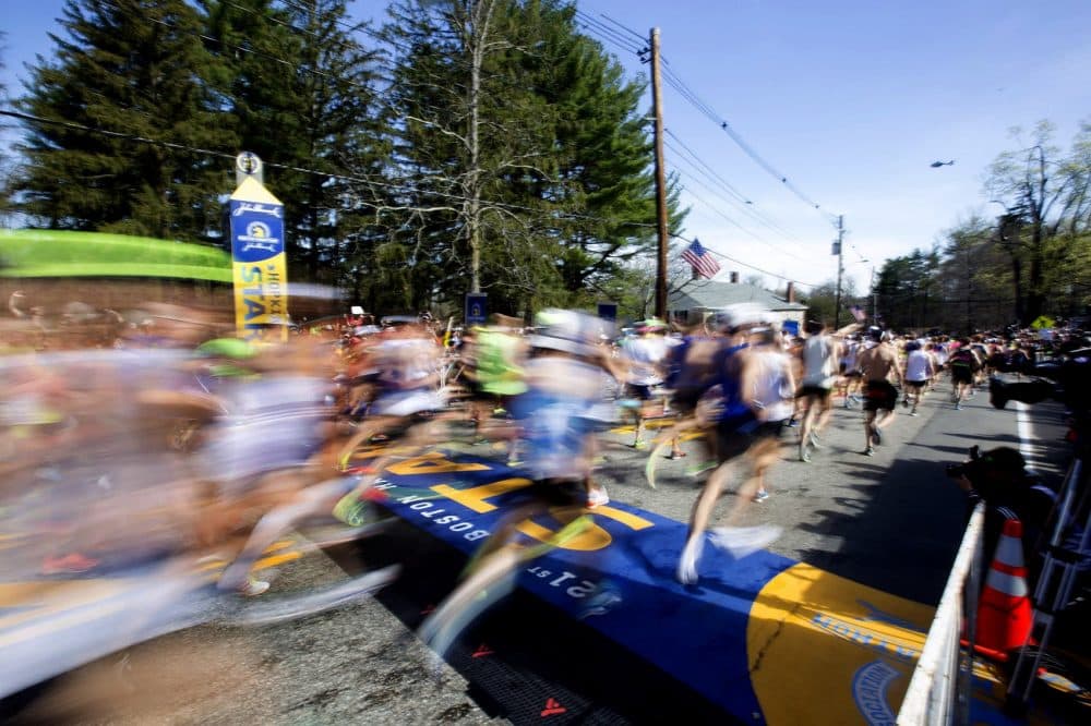 The Men’s Elite Division and Wave 1 take off at the start of the 2017 Boston Marathon. (Joe Difazio for WBUR)