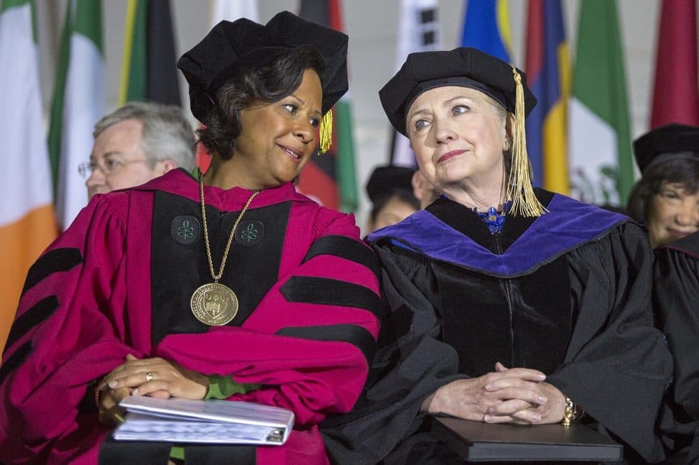 Wellesley College President Paula Johnson speaks with Hillary Clinton on the stage of the 2017 Commencement. (Robin Lubbock/WBUR)
