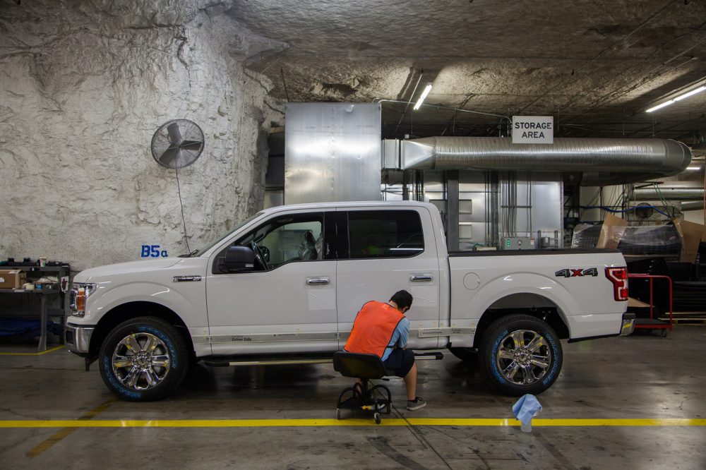 "Automotive Alley" in SubTropolis, where Ford Transit cargo vans and F-150 trucks are painted and upfitted for commercial sale. (Dean Russell/Here & Now)