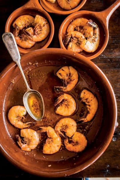 Sizzling shrimp with garlic and pimentón, from "Unforgettable: The Bold Flavors of Paula Wolfert's Renegade Life," by Emily Kaiser Thelin, Andrea Nguyen, Eric Wolfinger and Toni Tajima. (Courtesy)