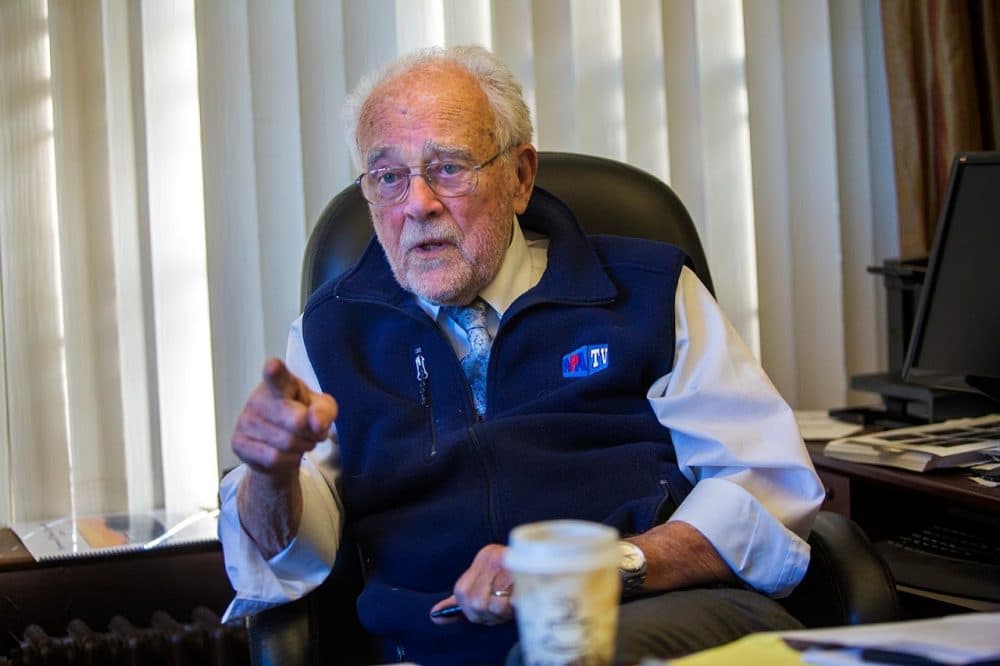 Norwood Town Manager John Carroll at his desk at Town Hall. (Jesse Costa/WBUR)
