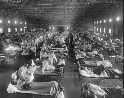 Influenza victims crowd into an emergency hospital near Fort Riley, Kan., in this 1918 file photo. (National Museum of Health/AP)