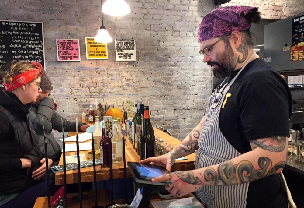 Co-owner Jesse Hassinger at Belly of the Beast in Northampton, Massachusetts. (Karen Brown/NEPR)