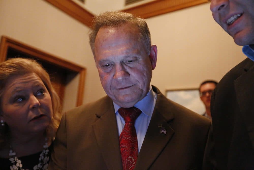 Republican U.S. Senate candidate Roy Moore, center, looks at election returns with staff during an election-night watch party at the RSA activity center, Tuesday, Dec. 12, 2017, in Montgomery, Ala. (Brynn Anderson/AP)