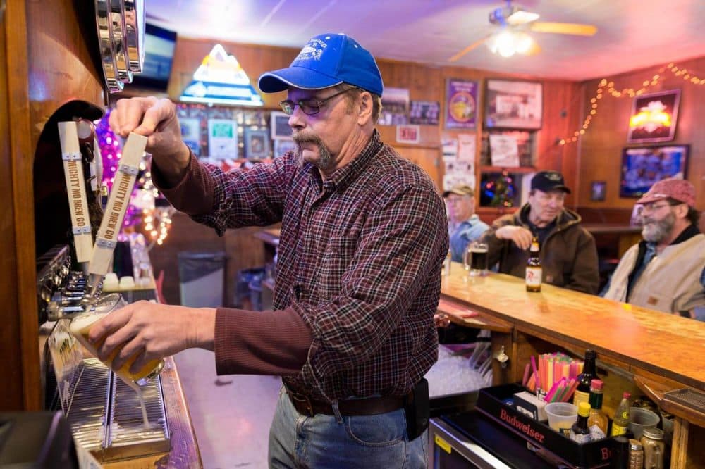 Tracey Somerfeld at Les’ Bar drafts a pint of local craft beer. He still farms barley when he’s not helping his son run the bar. A head of poor-quality malt barley taken directly from a field in Power, Mont. Heat and a lack of water resulted in small and light kernels. Grain rejected for malt barley often ends up as animal feed. (Courtesy Tony Bynum)