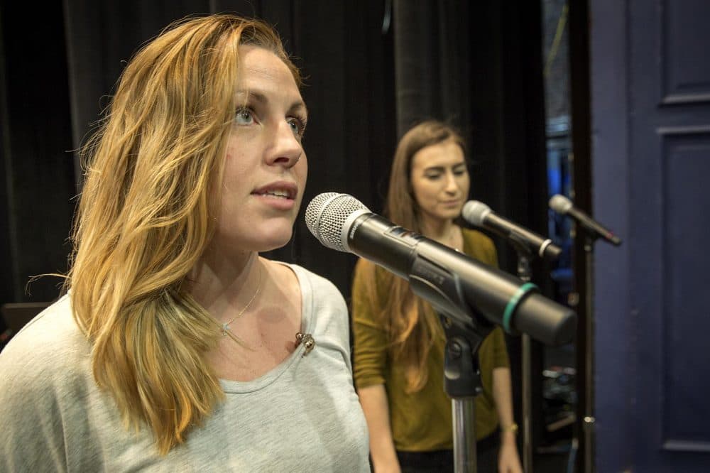 Caitlin Gillespie sings the lullaby she wrote for her daughter Harper Rose, at the Huntington Theatre with Palaver. (Robin Lubbock/WBUR)