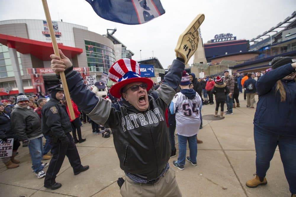 Dan Sancomb of Billerica attempts to get the crowd going. (Jesse Costa/WBUR)