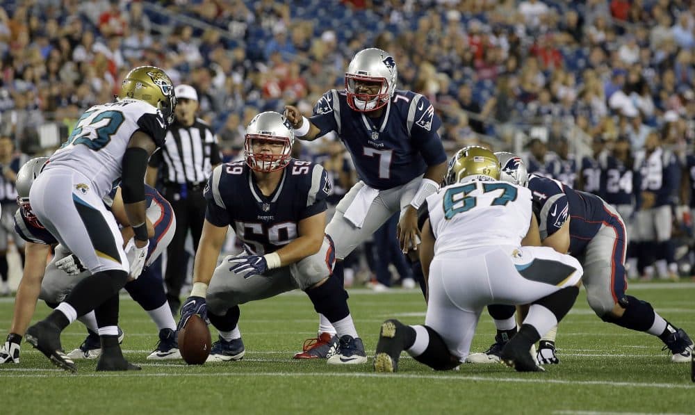 Then-Patriots quarterback Jacoby Brissett calls signals behind center James Ferentz (59) in a preseason game against the Jacksonville Jaguars, on Aug. 10, 2017. (Steven Senne/AP)